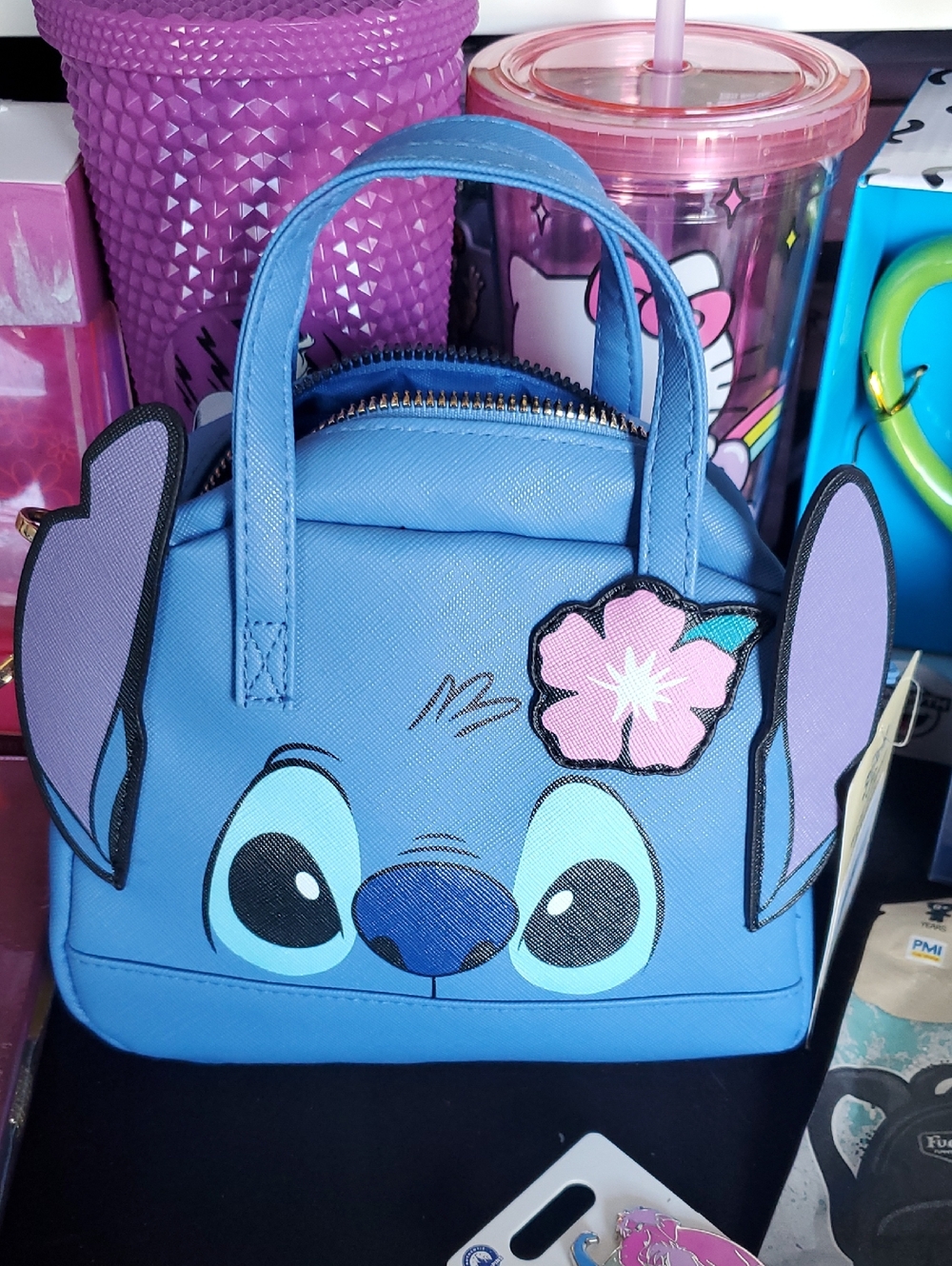 Blue Stitch Character Handbag with Pink Flower Accent